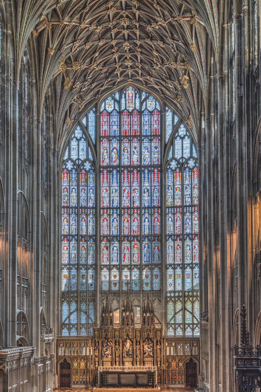 Floor-to-ceiling tiered and canted window depicting the Church’s earthly authorities, saints, Apostles, Mary and Christ, and the heavenly realm of angels, 22 × 14 m (roughly the size of a tennis court)